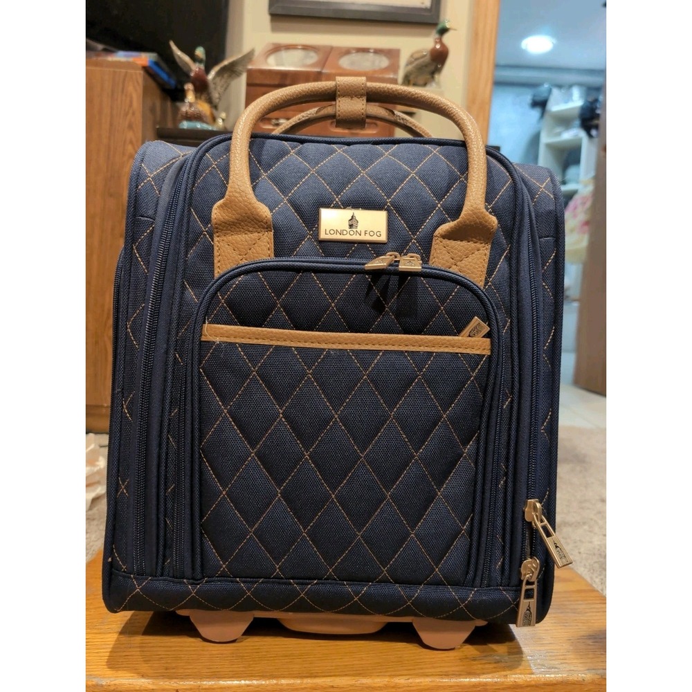 London Fog Queensbury 15" navy and tan rolling bag. Airline approved carry on!